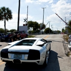 Federal agent driving off in the LP640